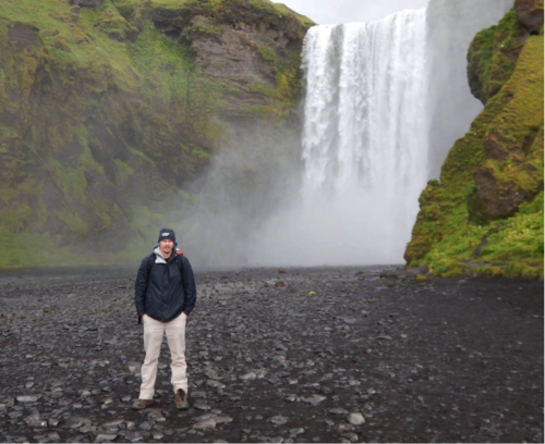 Nicholas Randall, a student at Iceland School of Energy, in front of Skógarfoss