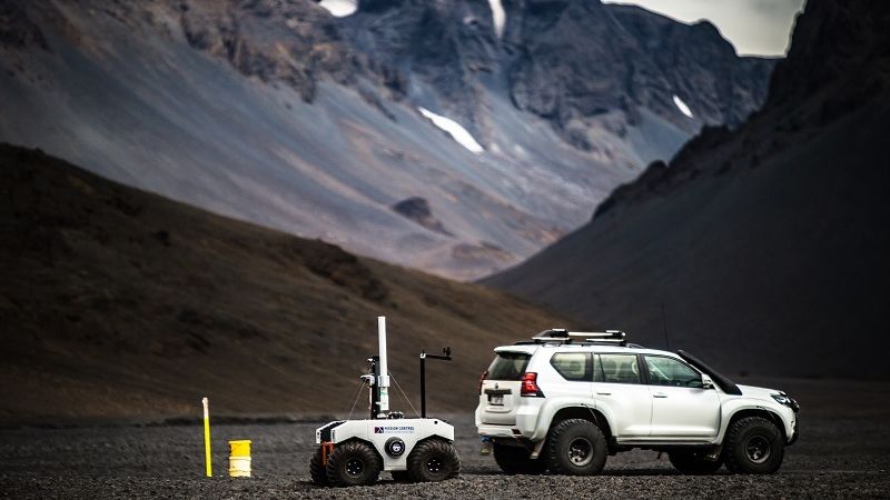 Jeeps and survey boats are seen out in the Icelandic nature
