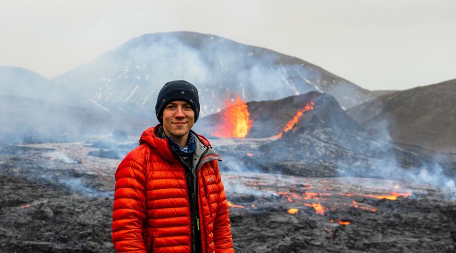 Matt Villante posing in front of a volcano 2